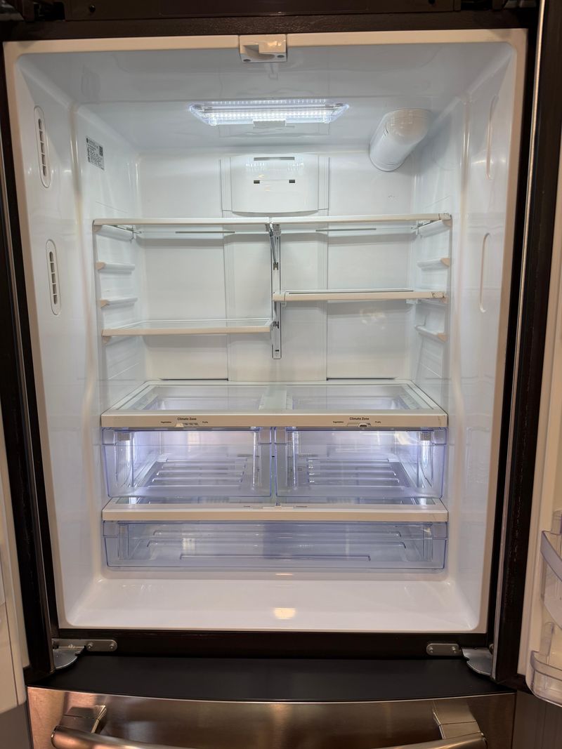 The inside of a refrigerator cleaned shelf by shelf