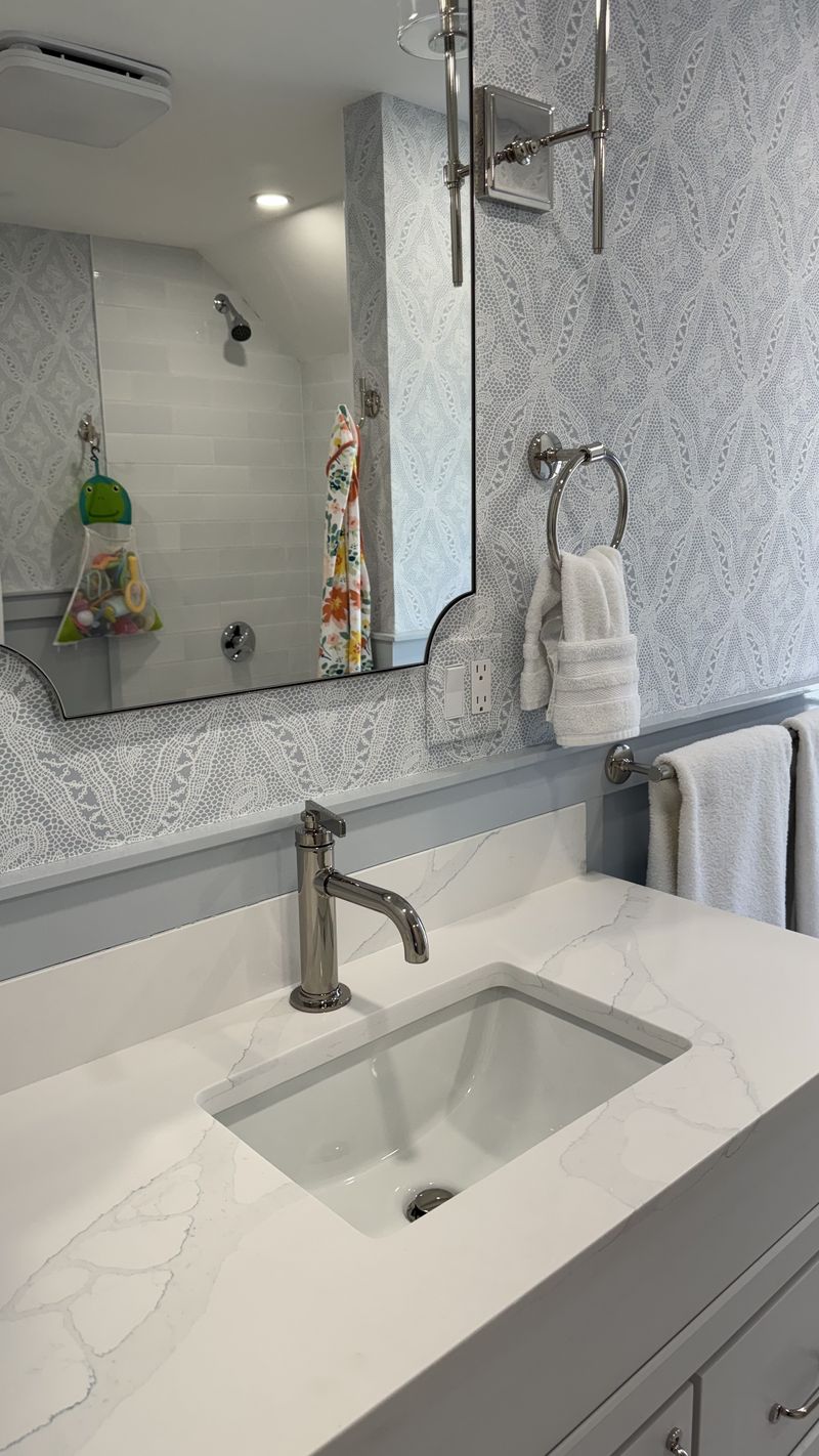 A marble bathroom vanity with fixtures polished