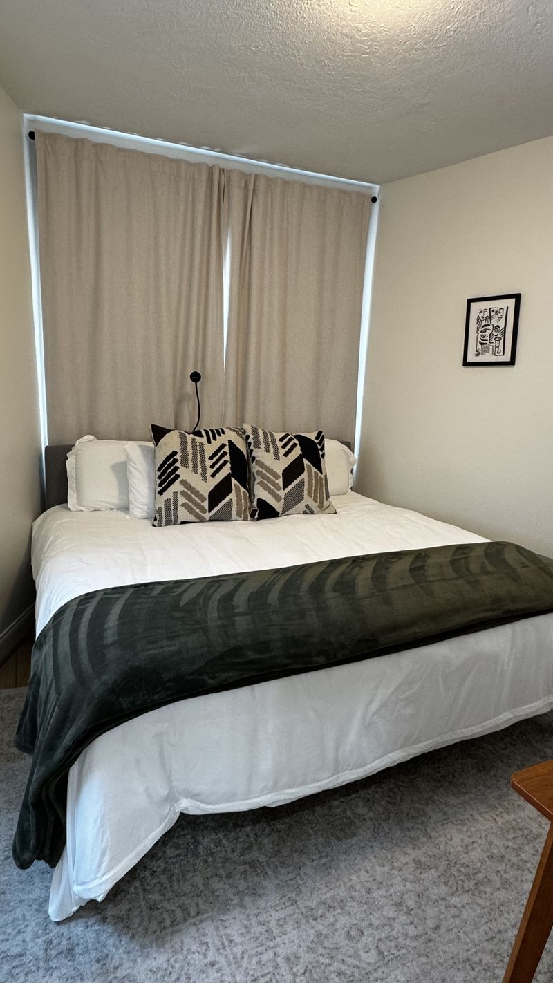A bed made with fresh linens after a visit