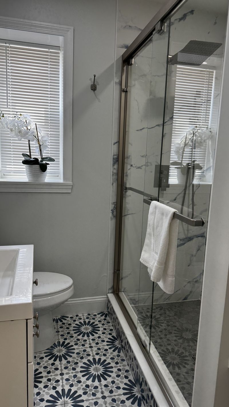 A glass shower enclosure cleaned streak-free