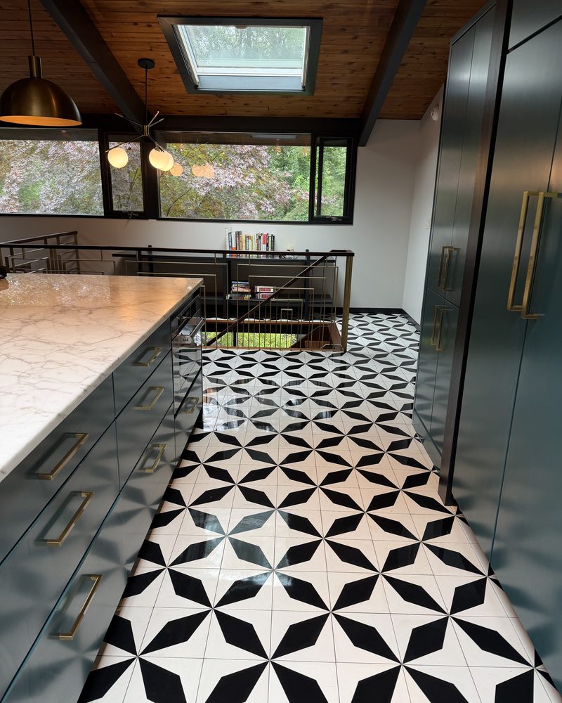 A galley kitchen and graphic tile floor left spotless