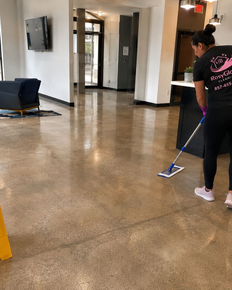 A RosyGloves cleaner mopping a commercial lobby floor