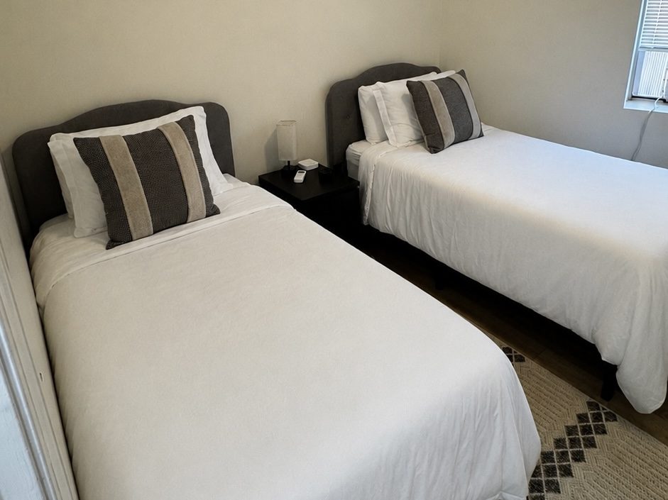 Freshly made beds prepared for Airbnb guests